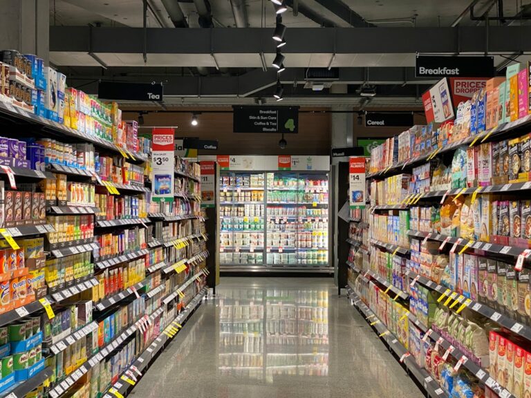grocery store aisle with stocked shelves